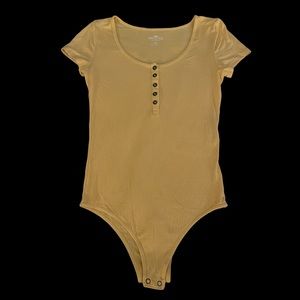Hollister Ribbed Yellow Button-down Bodysuit in size Medium